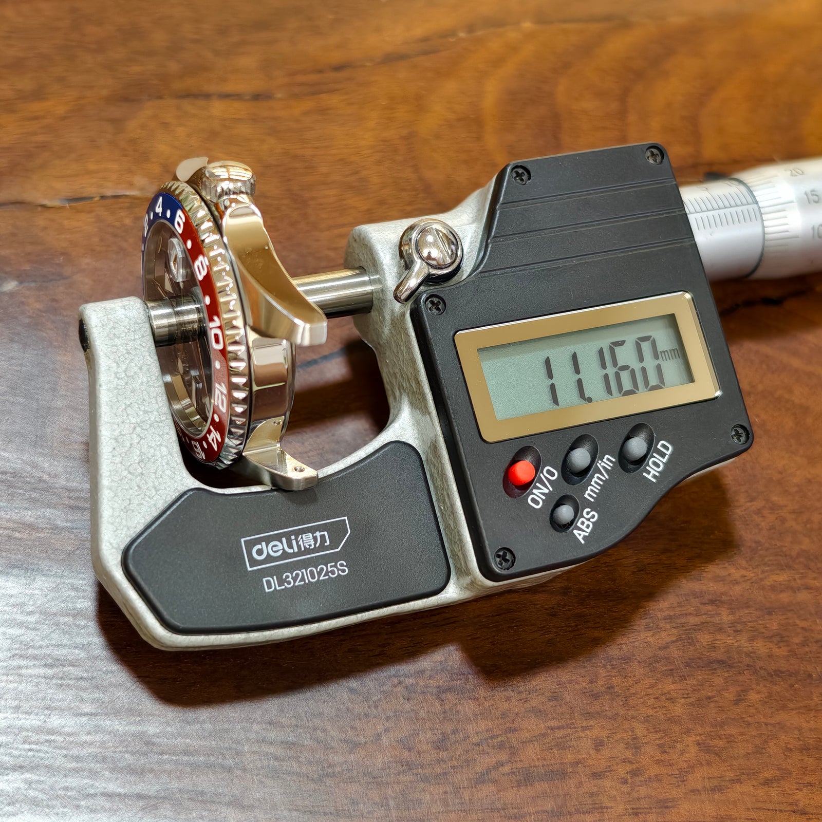 SKX013 GMT 38 case measured across its thickness in a digital micrometer — Pepsi colourway shown