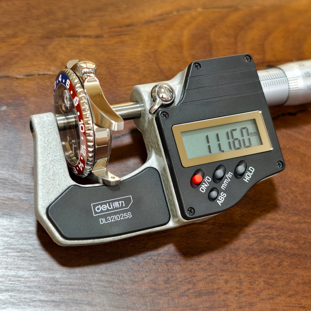 SKX013 GMT 38 case measured across its thickness in a digital micrometer — Pepsi colourway shown